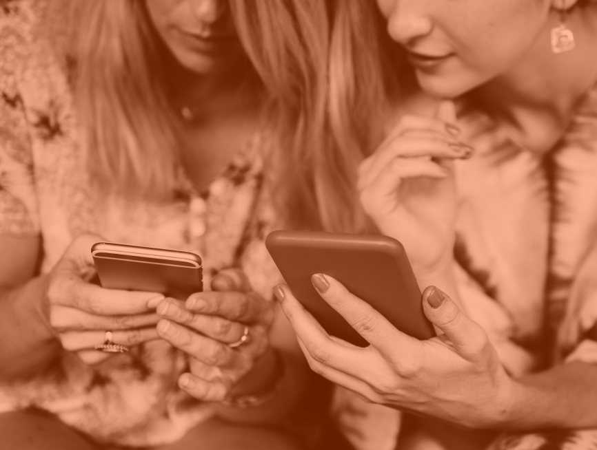 Two people on phone discussing social media